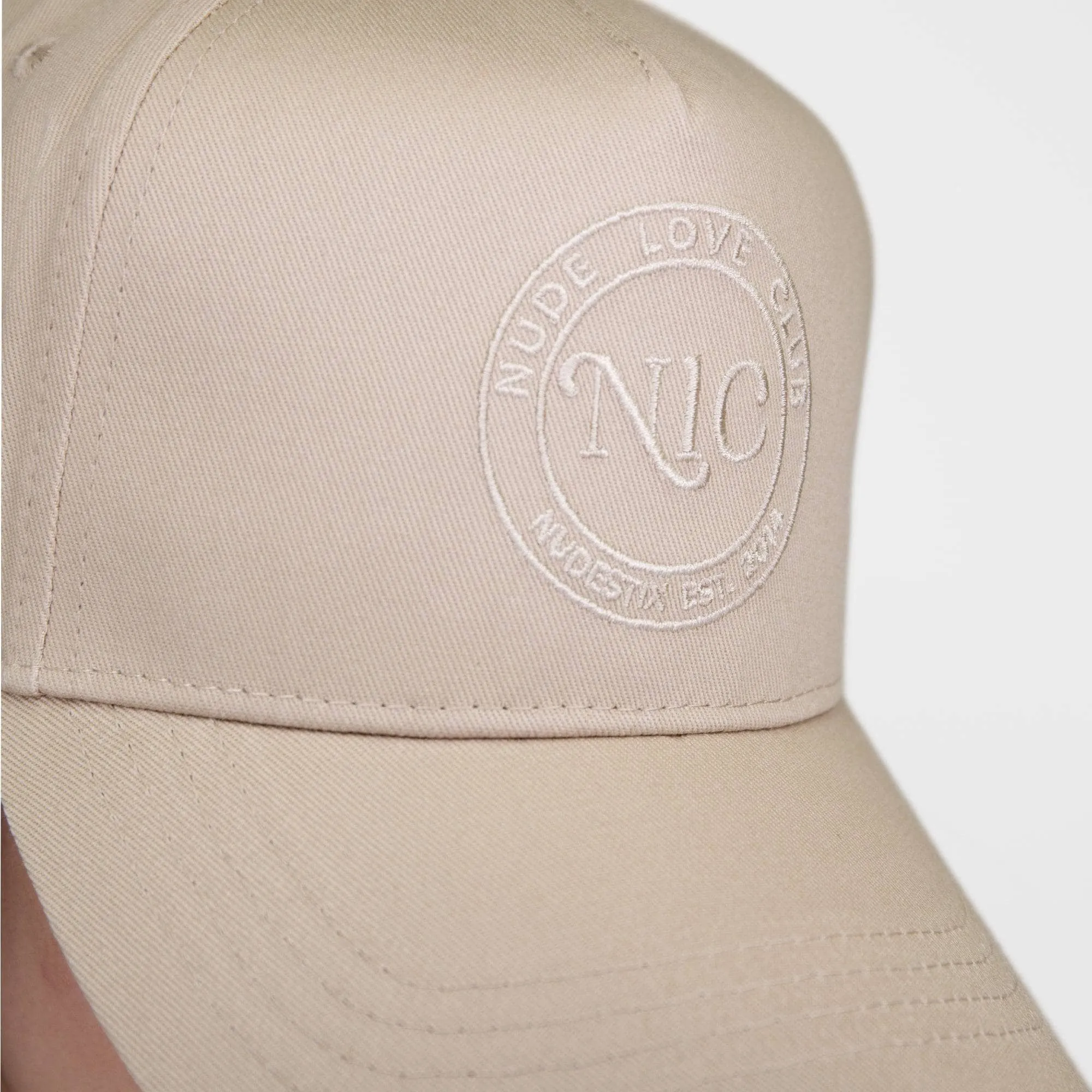 NUDE LOVE CLUB EMBLEM TRUCKER HAT