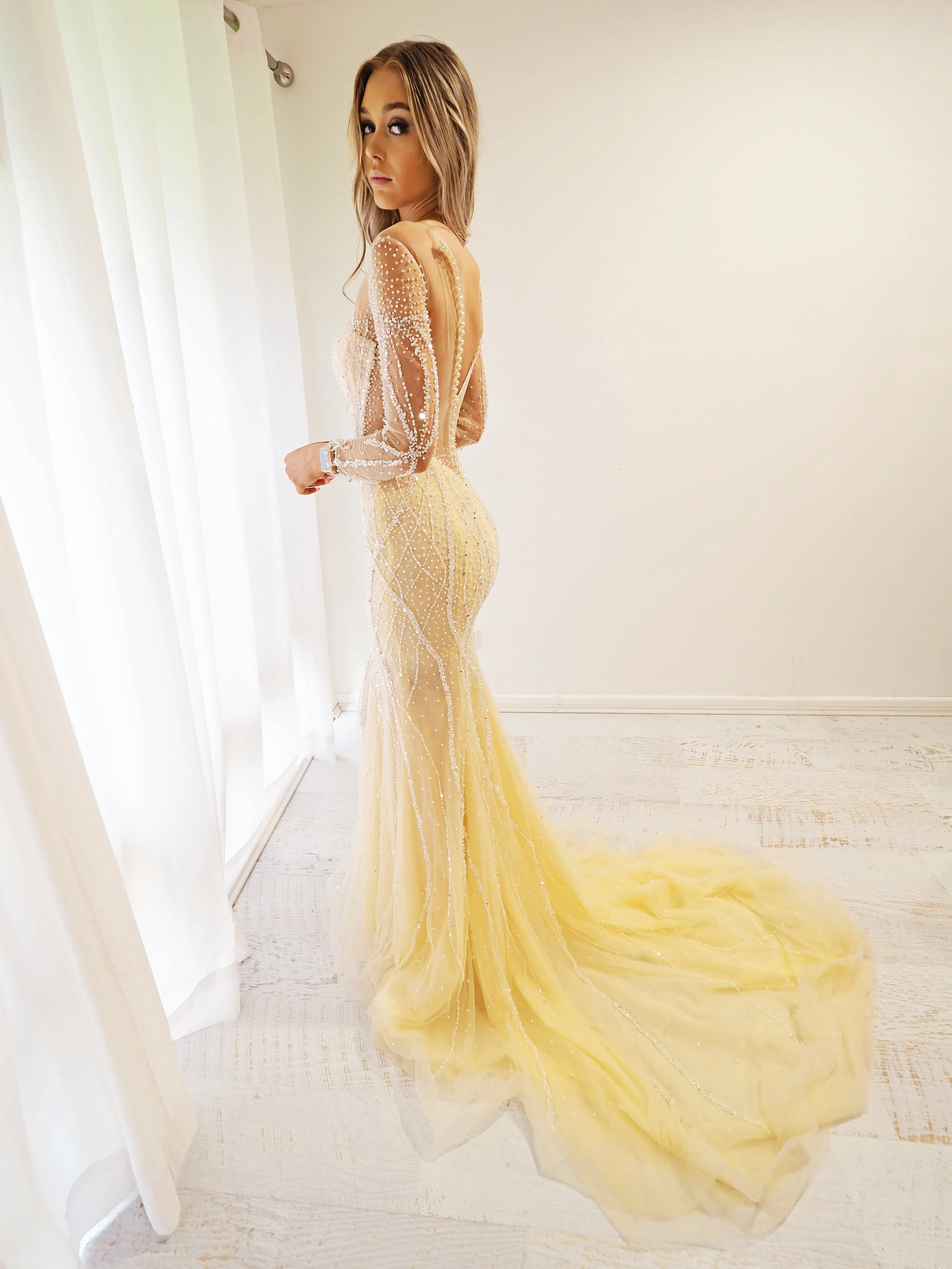 Sparkling Gold Beaded Deep V Mermaid Dress with long sleeves for hire.